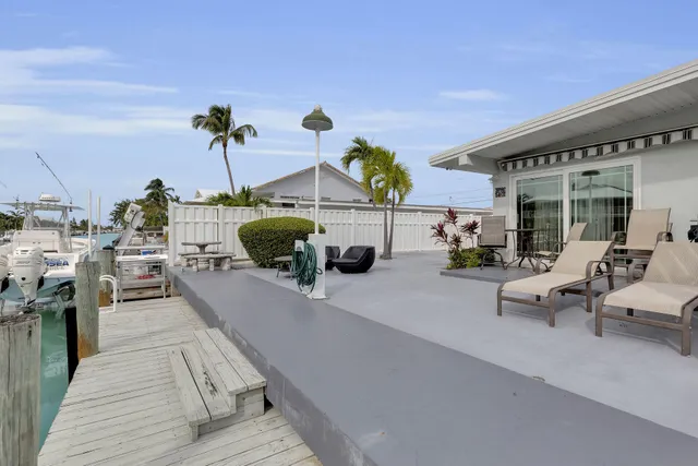 a view of a swimming pool with outdoor seating space