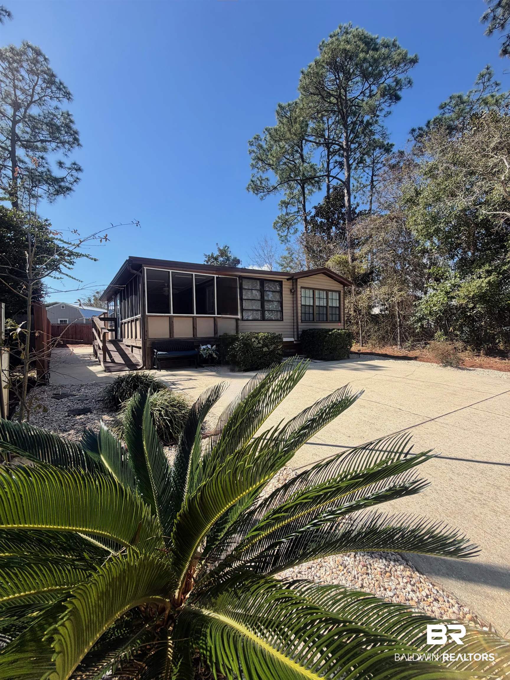685 Escambia Loop Lillian, AL 36549 - Photo 24 of 43 View of front of home with a sunroom