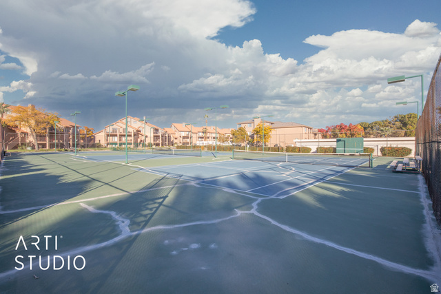 860 South Village Road, Unit A6 St. George, UT 84770 - Photo 24 of 41 View of tennis court featuring a residential view