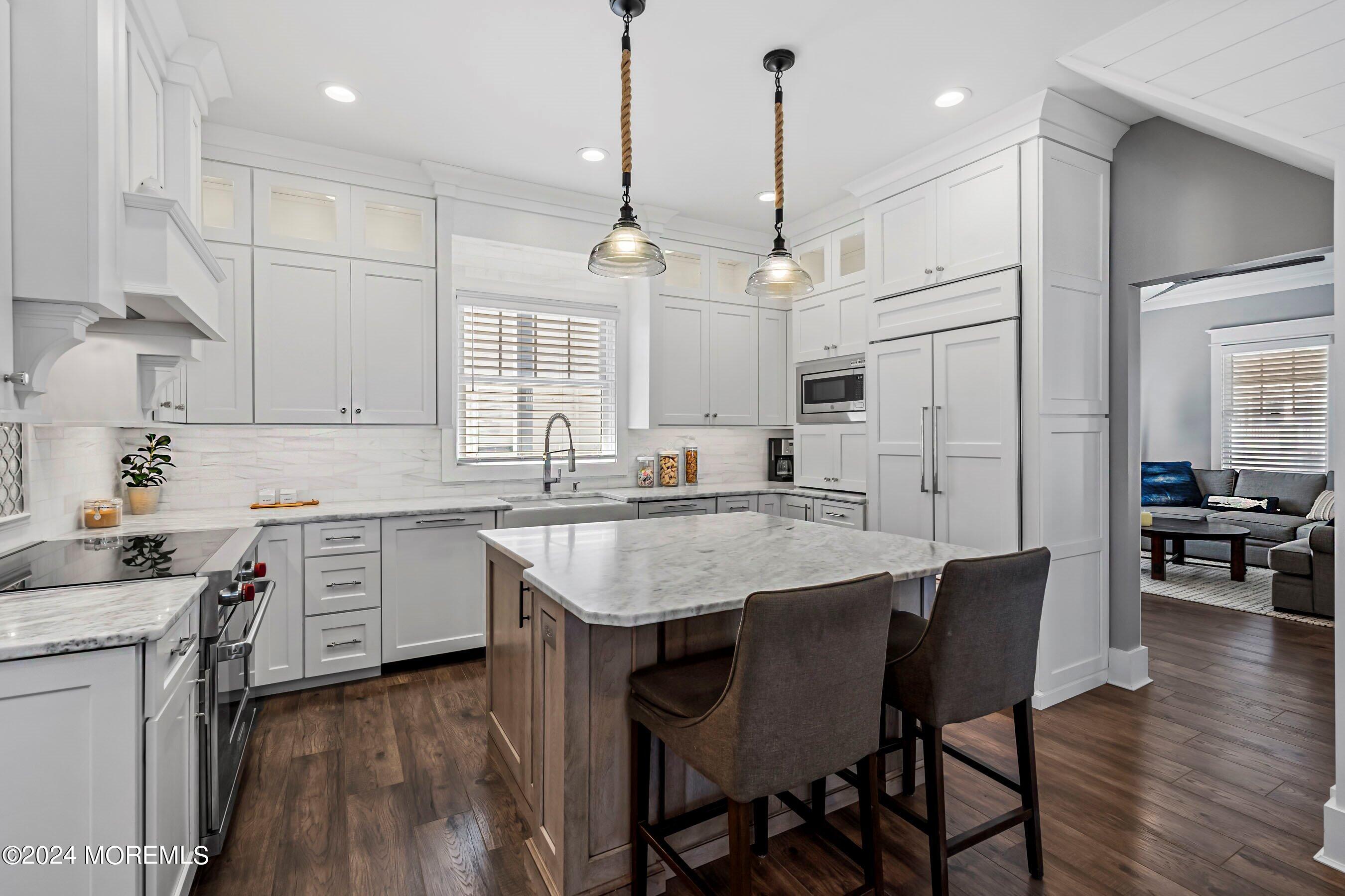 100 Forman Avenue Point Pleasant Beach, NJ 08742 - Photo 11 of 46 a kitchen with a center island appliances and cabinets