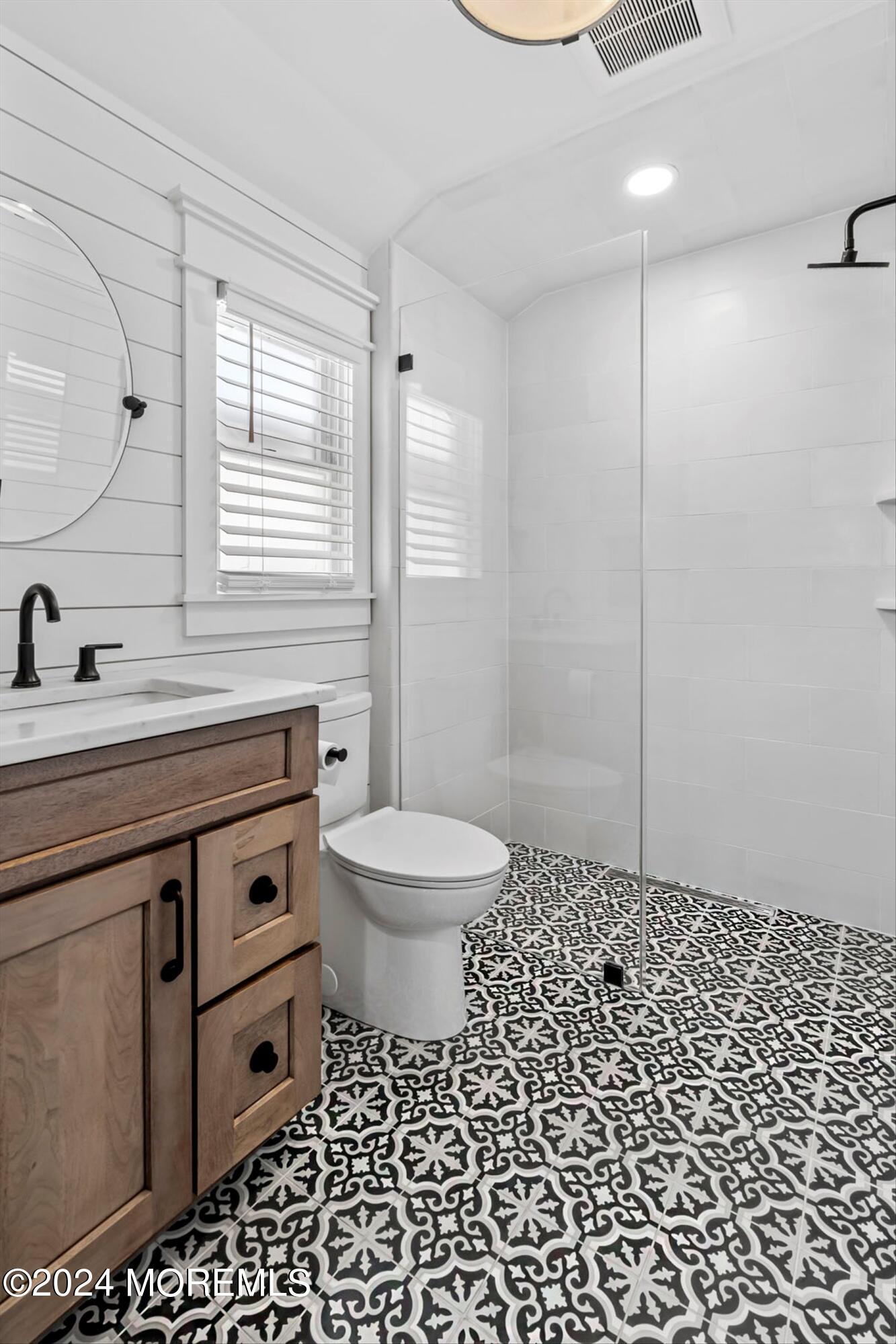 100 Forman Avenue Point Pleasant Beach, NJ 08742 - Photo 13 of 46 a bathroom with a sink a toilet a window and a mirror