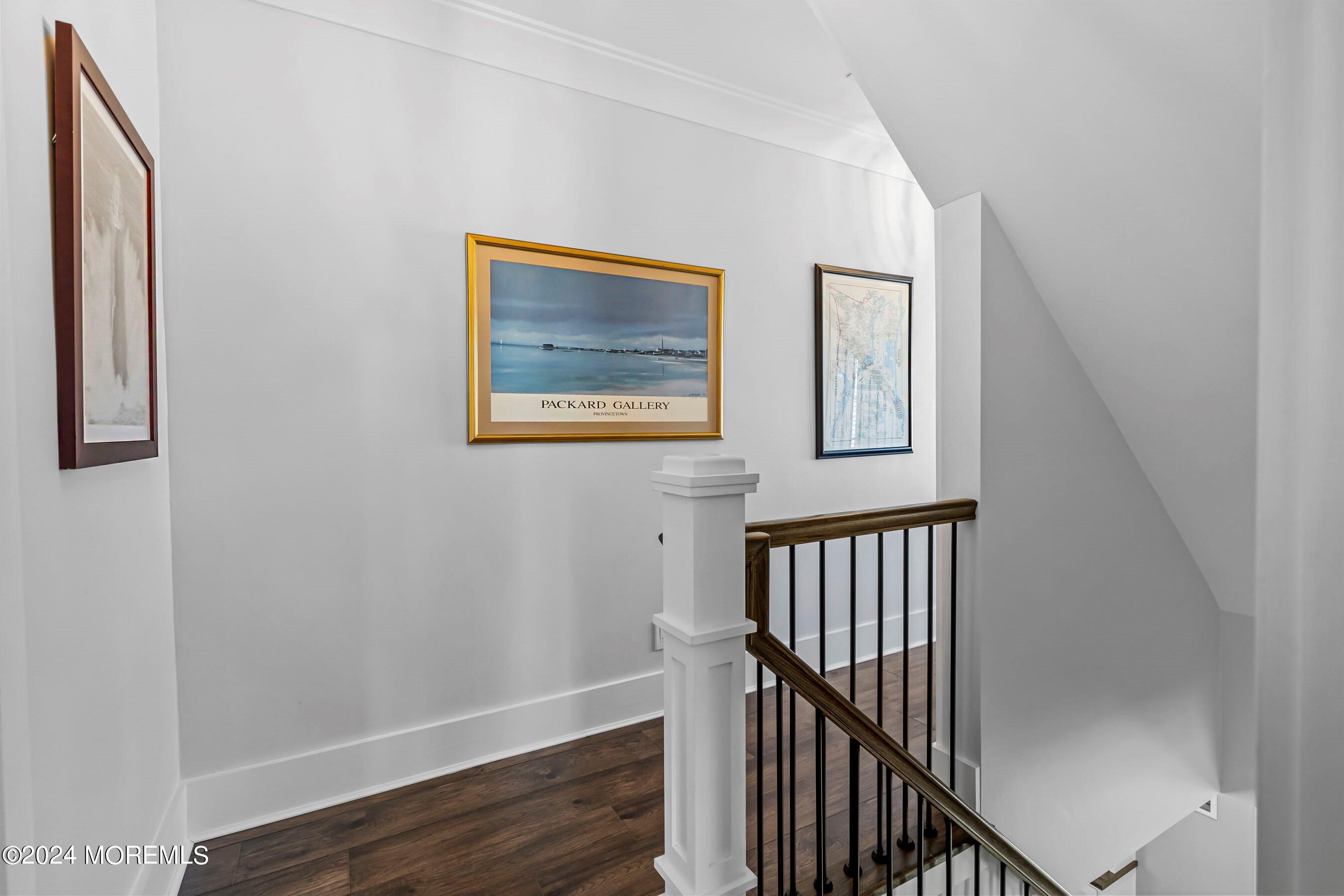 100 Forman Avenue Point Pleasant Beach, NJ 08742 - Photo 14 of 46 a view of staircase with wooden floor and fan