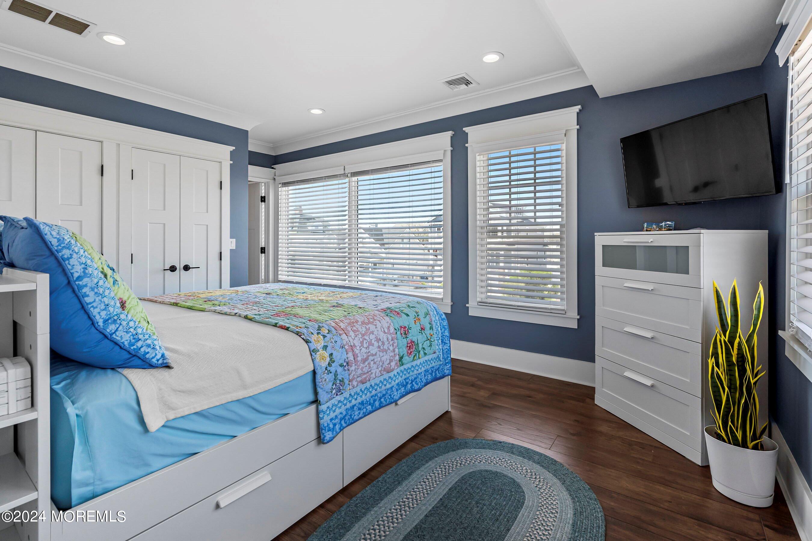 100 Forman Avenue Point Pleasant Beach, NJ 08742 - Photo 19 of 46 a bedroom with a bed and a television on the dresser