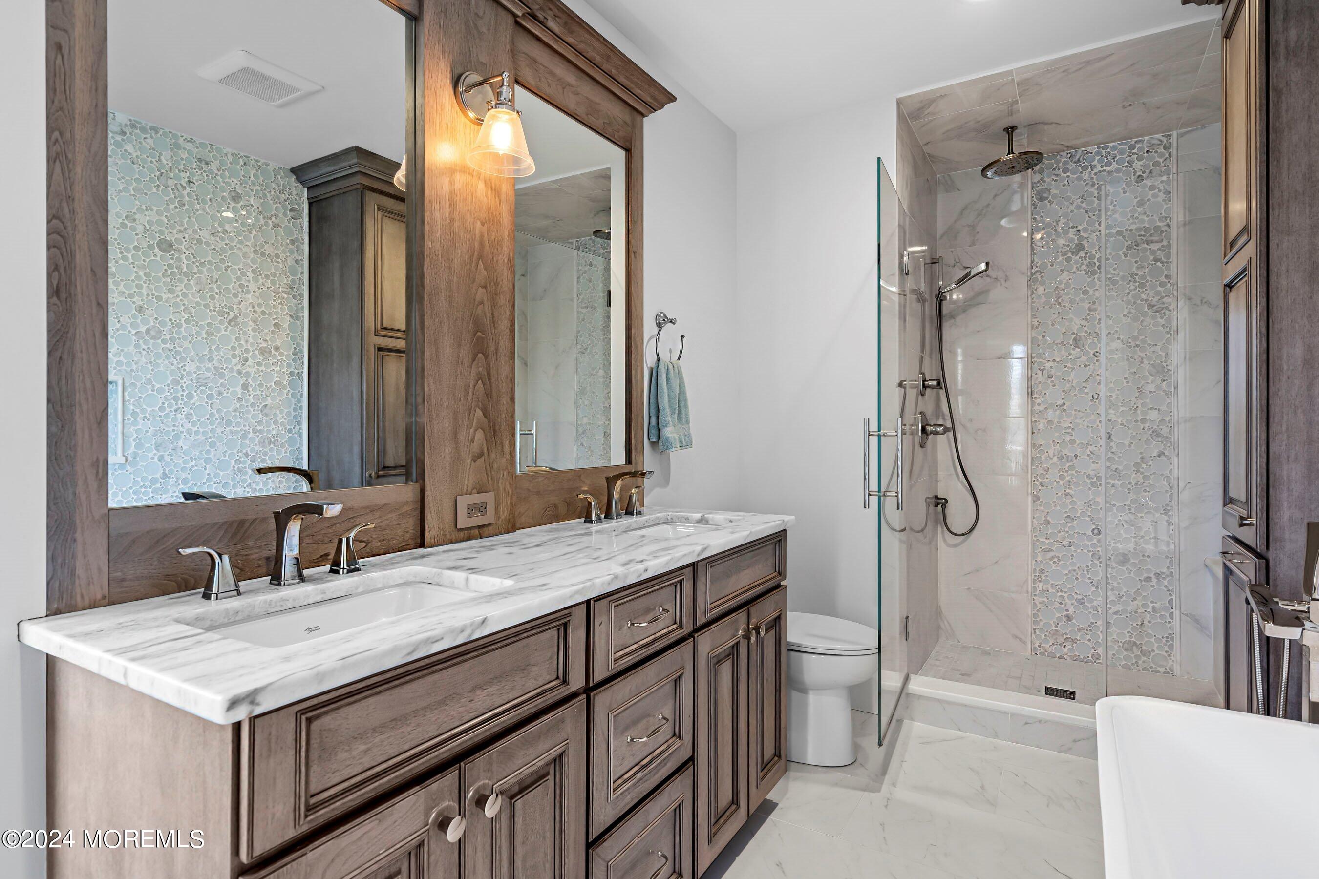 100 Forman Avenue Point Pleasant Beach, NJ 08742 - Photo 21 of 46 a bathroom with a sink a toilet and shower