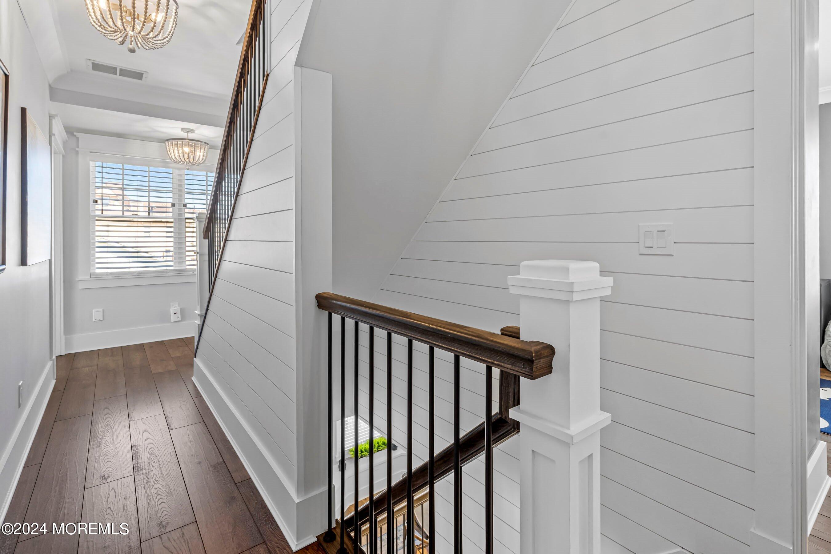 100 Forman Avenue Point Pleasant Beach, NJ 08742 - Photo 24 of 46 a view of a hallway with wooden floor and staircase