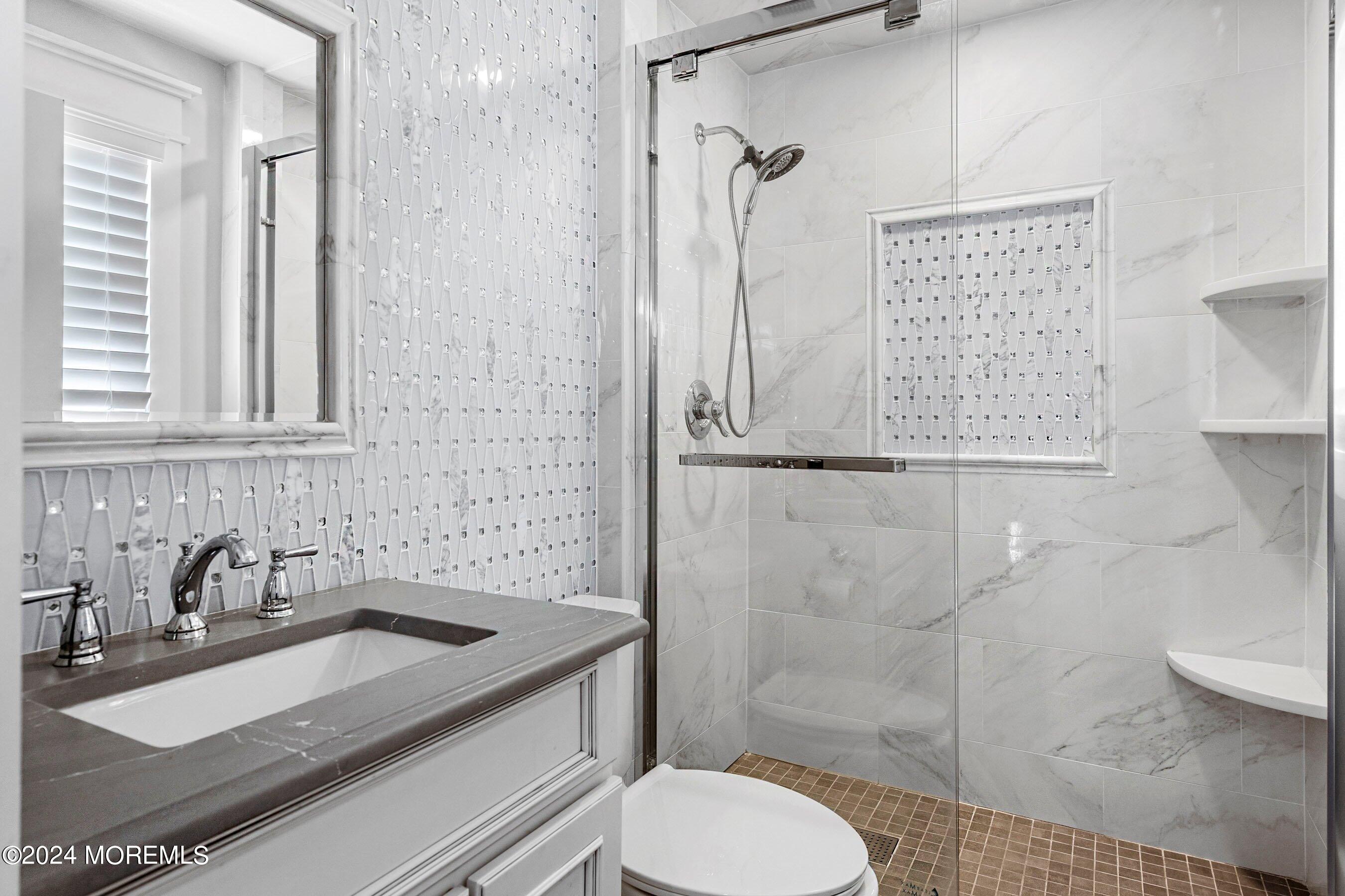 100 Forman Avenue Point Pleasant Beach, NJ 08742 - Photo 30 of 46 a bathroom with a sink toilet and shower
