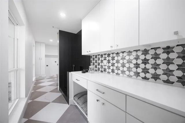 a bathroom with a glass shower door