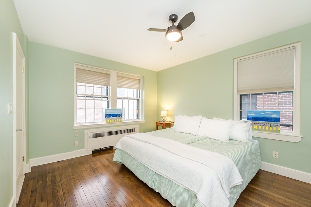 280 Beacon Street, Unit 65 Boston, MA 02116 - Photo 11 of 15 a bedroom with a large bed and a window