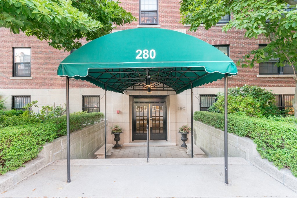 280 Beacon Street, Unit 65 Boston, MA 02116 - Photo 14 of 15 a front view of a house with a garage