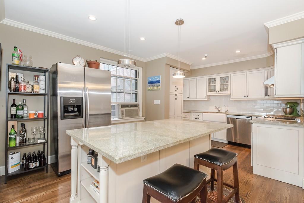 280 Beacon Street, Unit 65 Boston, MA 02116 - Photo 6 of 15 a kitchen with a refrigerator a stove a sink and a refrigerator