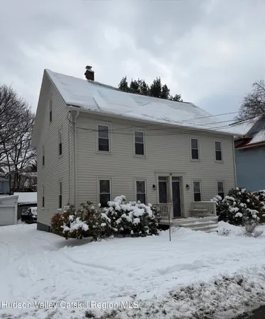 a view of a house with yard covered in front of house