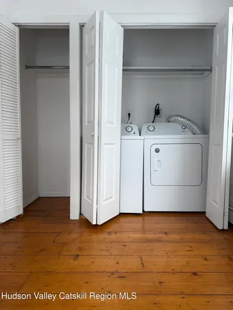 a view of cabinets and wooden floor