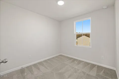 a view of a white house with many windows