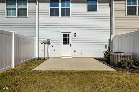 a view of a swimming pool with outdoor seating