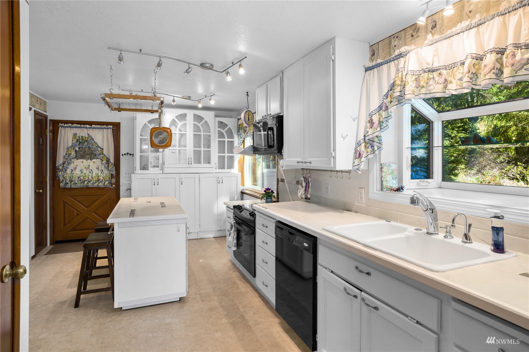 2141 Mason Benson Road East Grapeview, WA 98546 - Photo 11 of 40 a kitchen with a sink stove and refrigerator