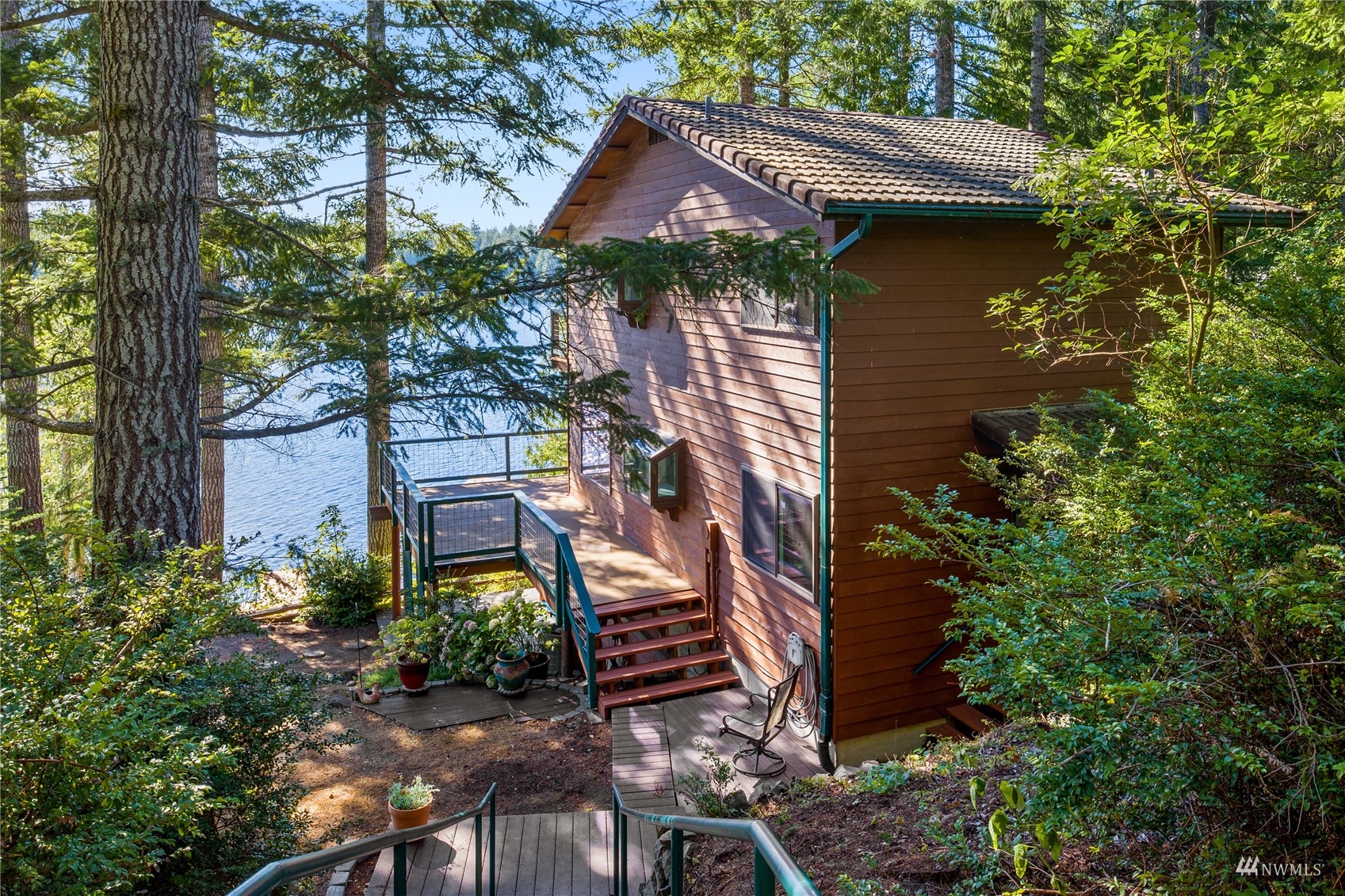 2141 Mason Benson Road East Grapeview, WA 98546 - Photo 2 of 40 a front view of a house with a yard