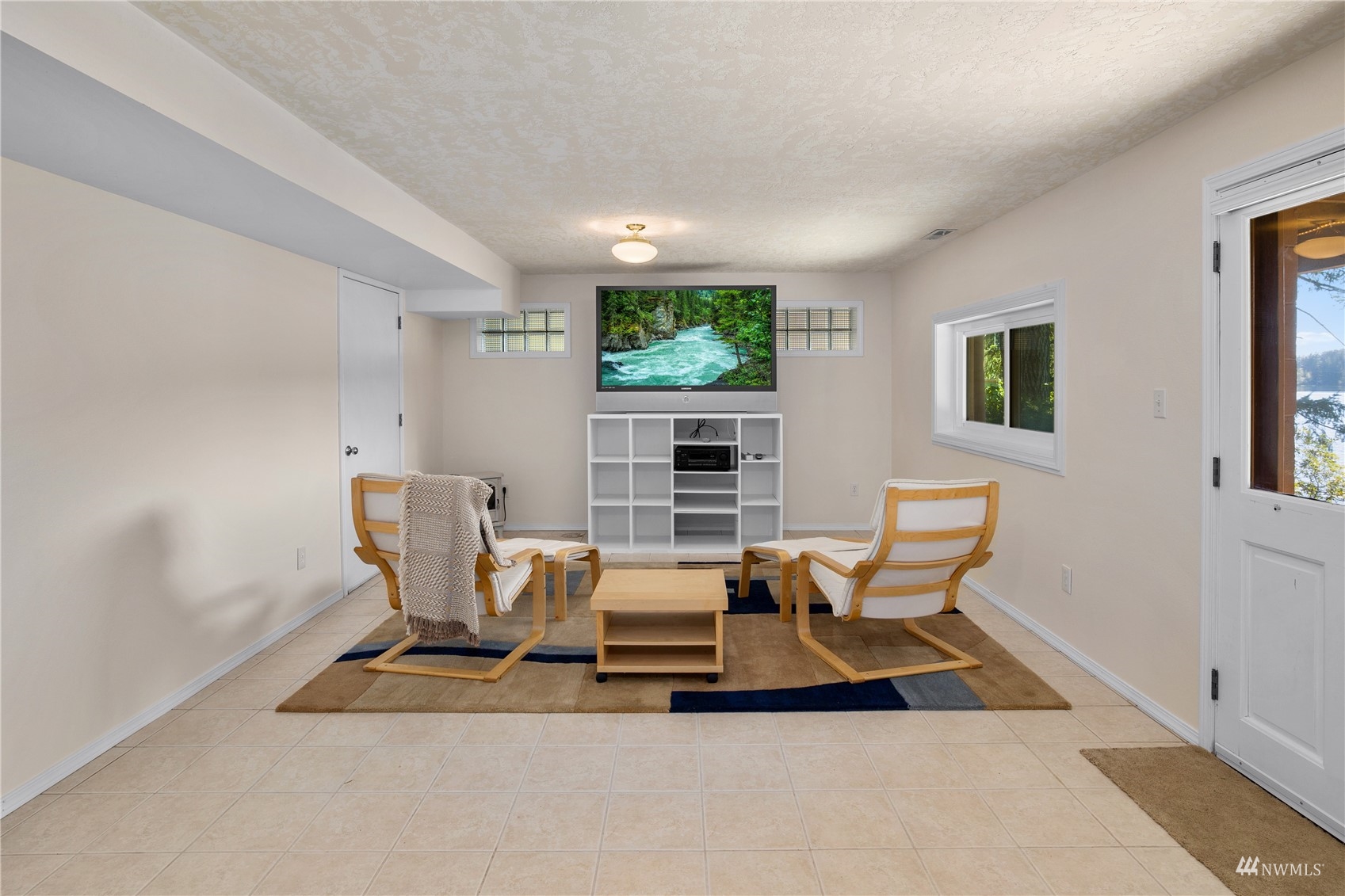 2141 Mason Benson Road East Grapeview, WA 98546 - Photo 24 of 40 a living room with furniture a window and chair