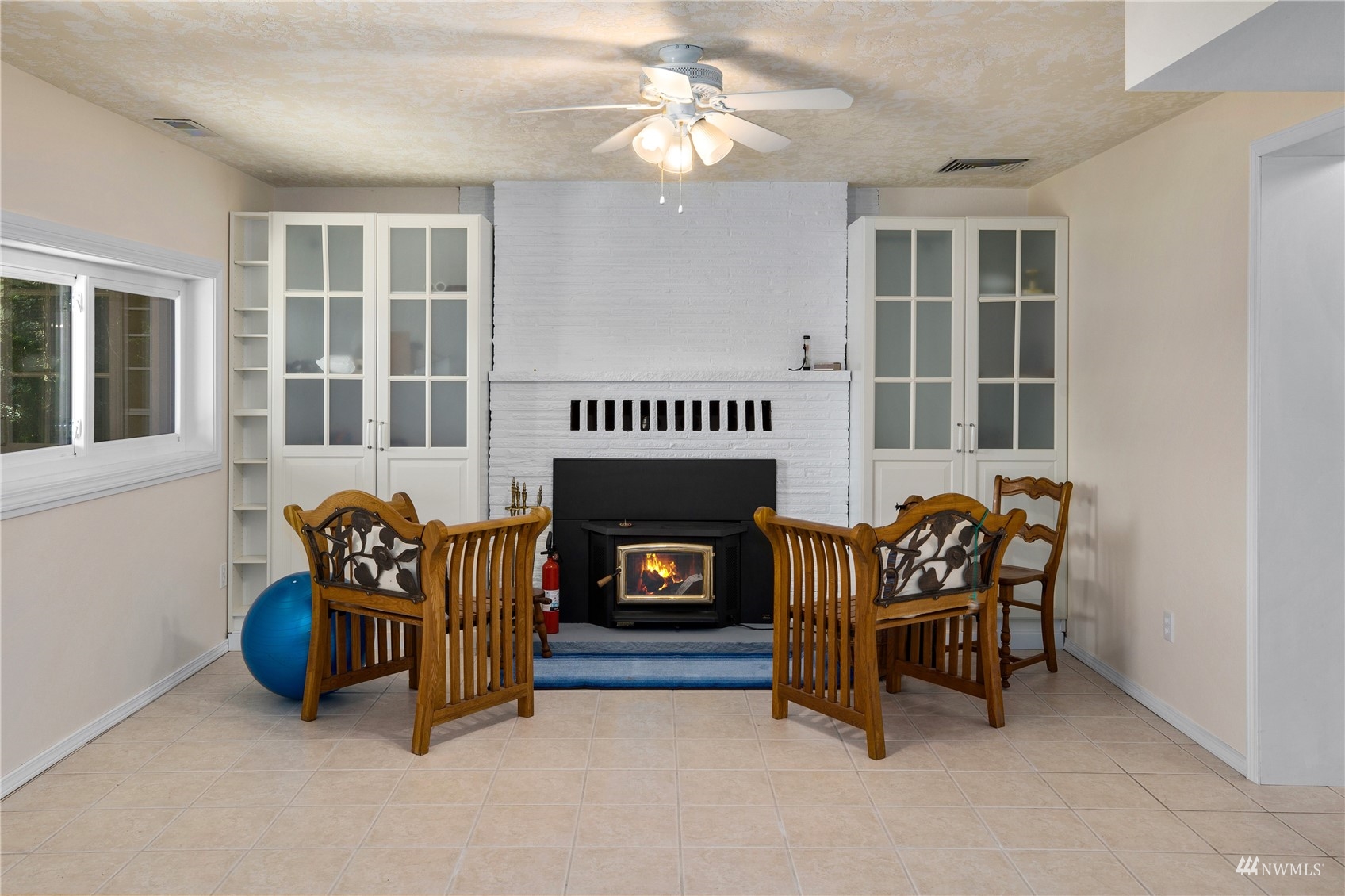 2141 Mason Benson Road East Grapeview, WA 98546 - Photo 26 of 40 a living room with furniture and a fireplace
