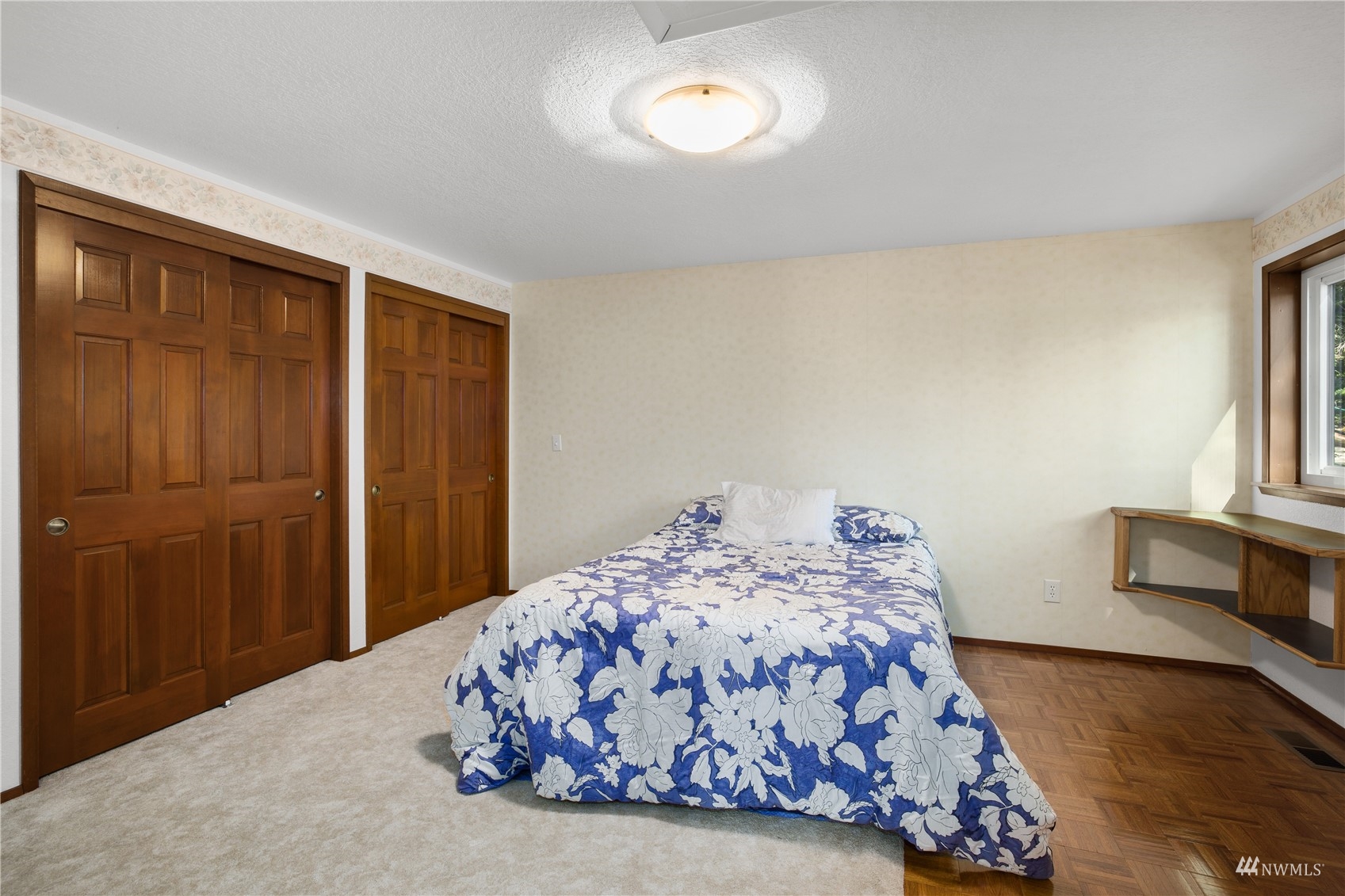 2141 Mason Benson Road East Grapeview, WA 98546 - Photo 27 of 40 a bedroom with a bed and a window