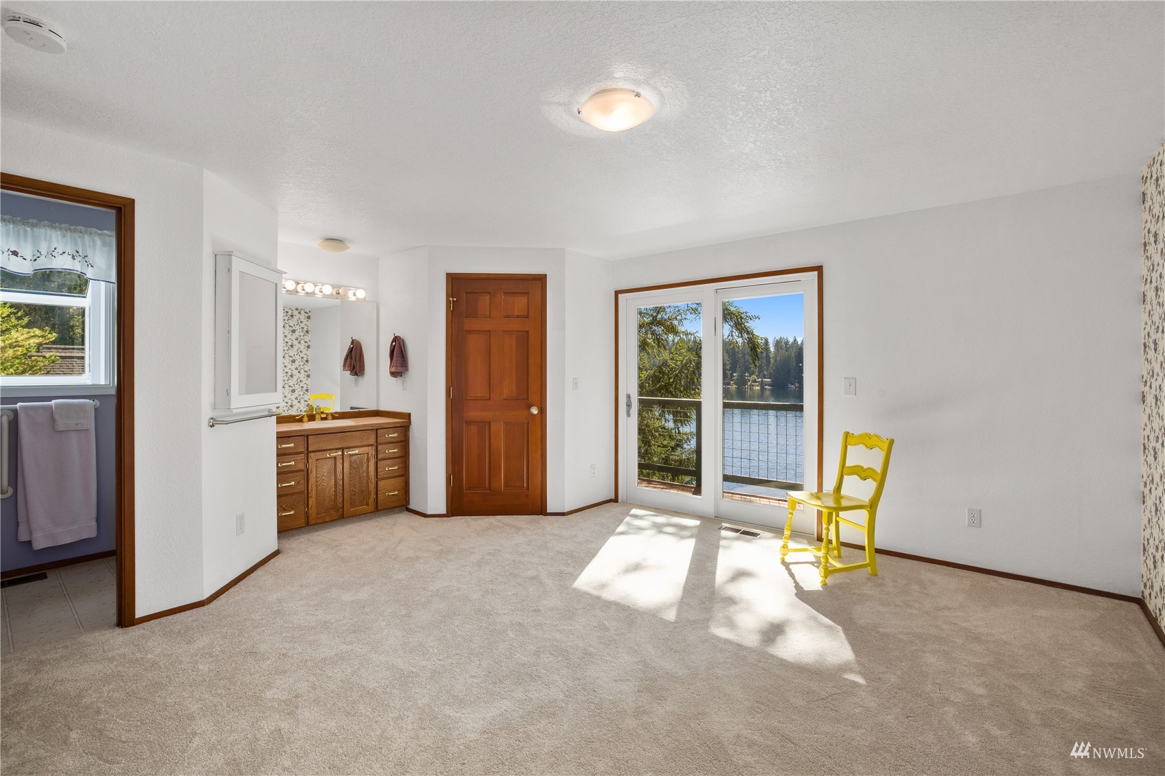 2141 Mason Benson Road East Grapeview, WA 98546 - Photo 28 of 40 a view of a kitchen with a sink cabinets and a living room