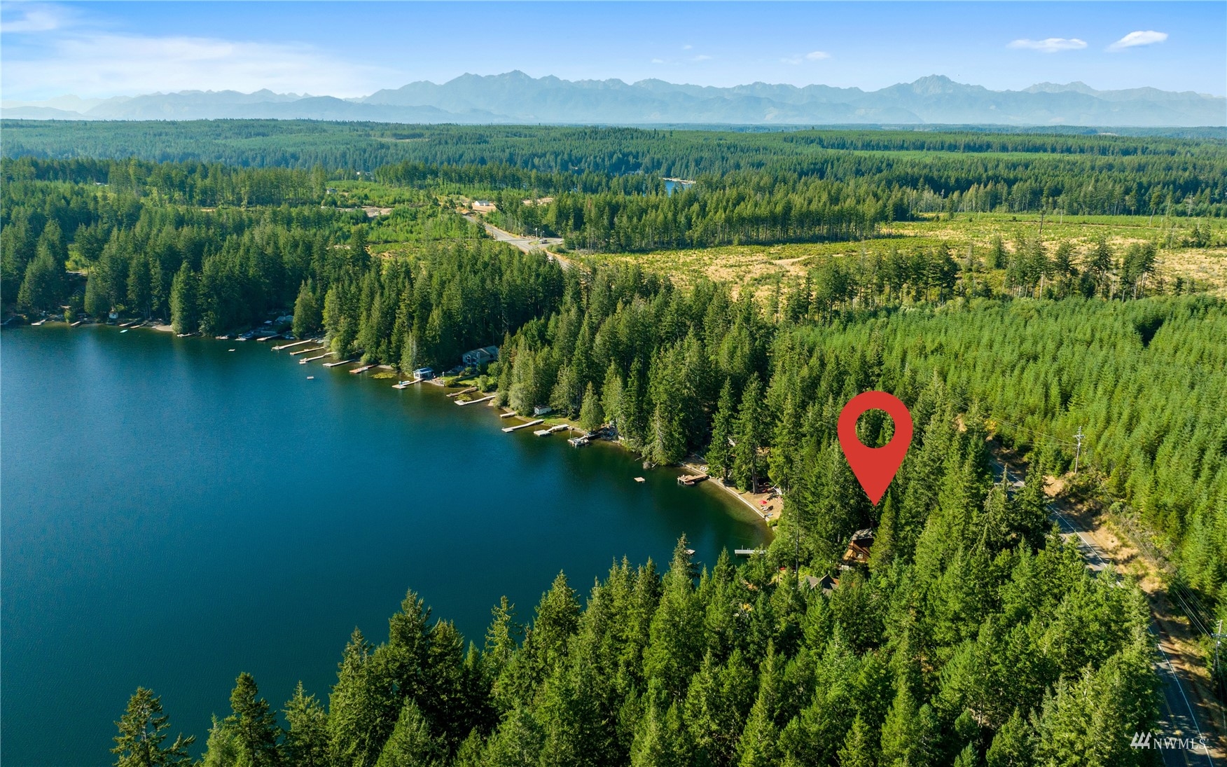2141 Mason Benson Road East Grapeview, WA 98546 - Photo 39 of 40 a view of a lake with a mountain in the background