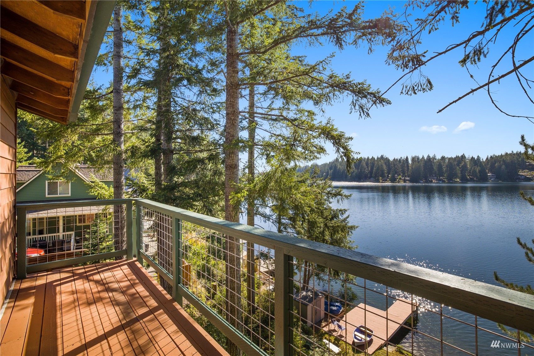 2141 Mason Benson Road East Grapeview, WA 98546 - Photo 9 of 40 a balcony with wooden floor and lake view