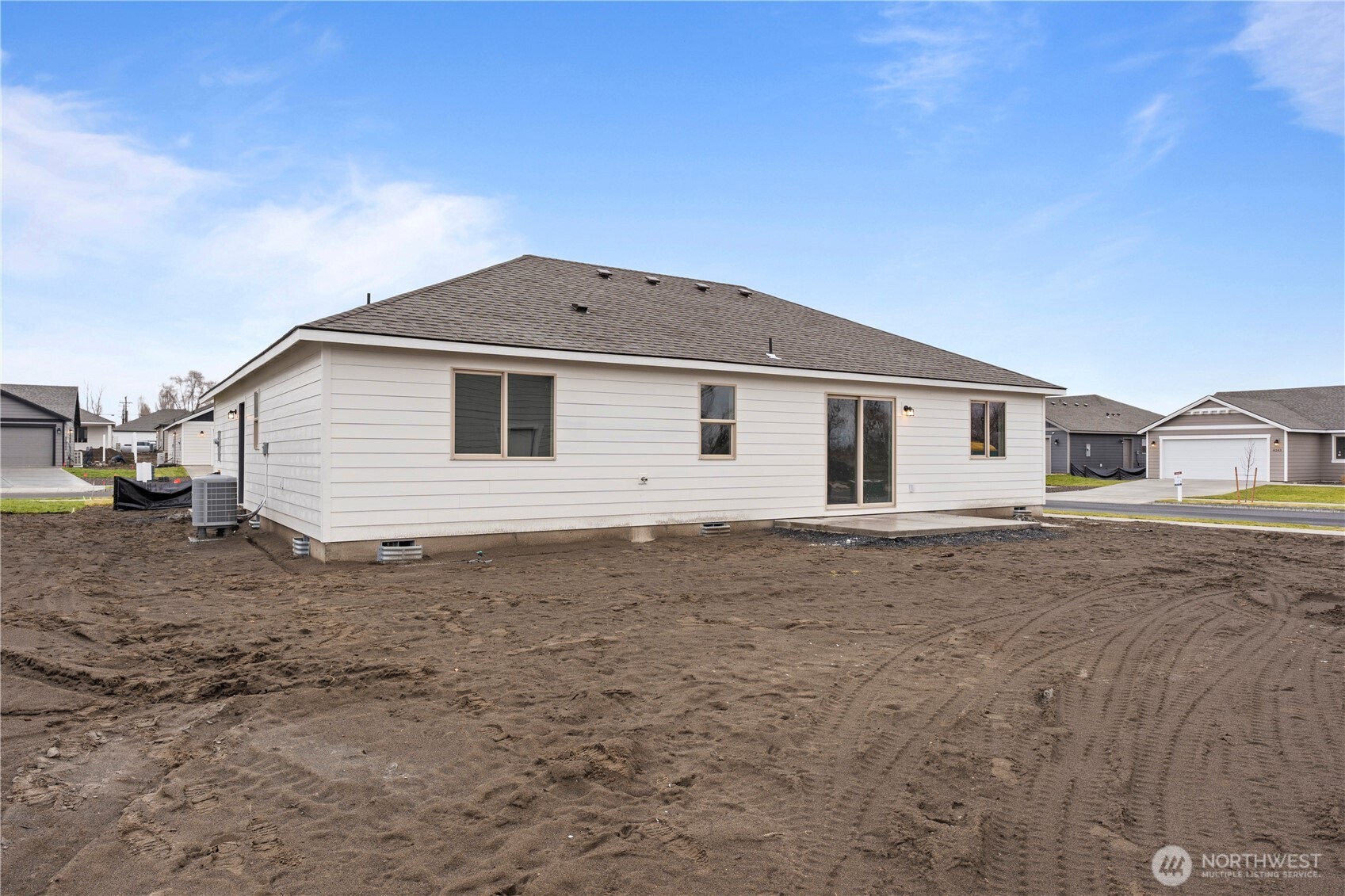202 North Sandy Loop Moses Lake, WA 98837 - Photo 23 of 24 a view of a house with a backyard