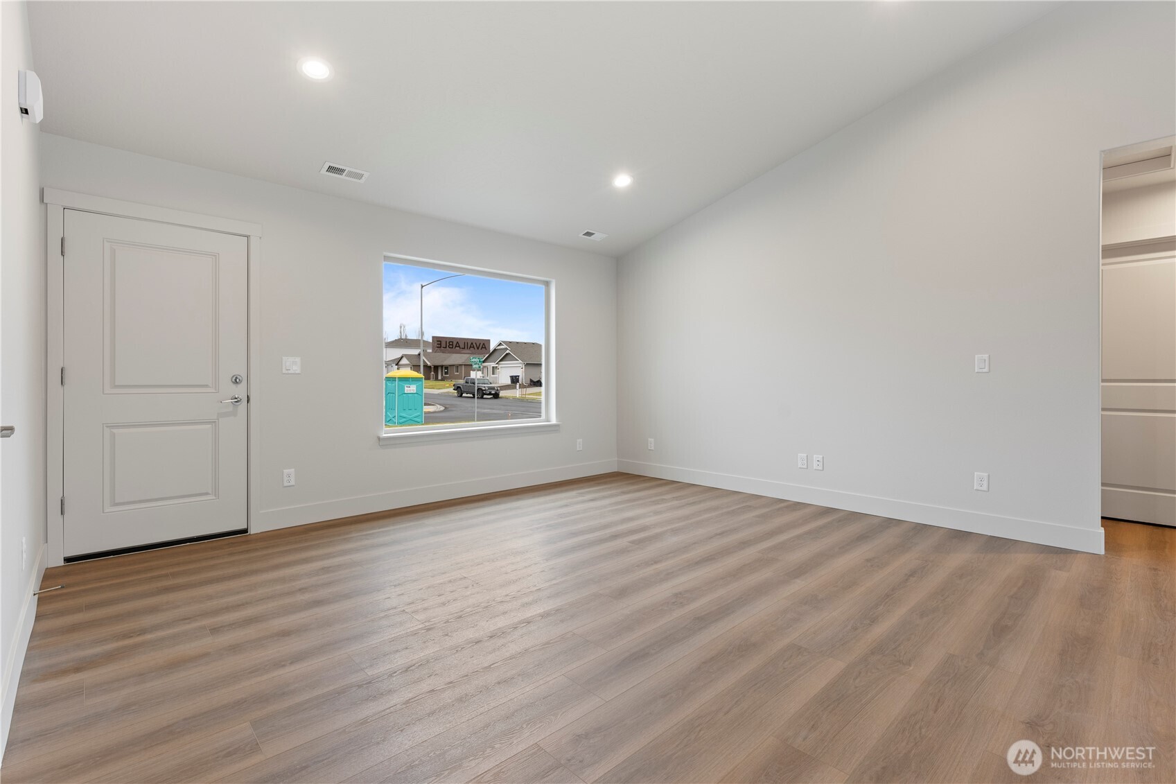 202 North Sandy Loop Moses Lake, WA 98837 - Photo 9 of 24 a view of an empty room and wooden floor