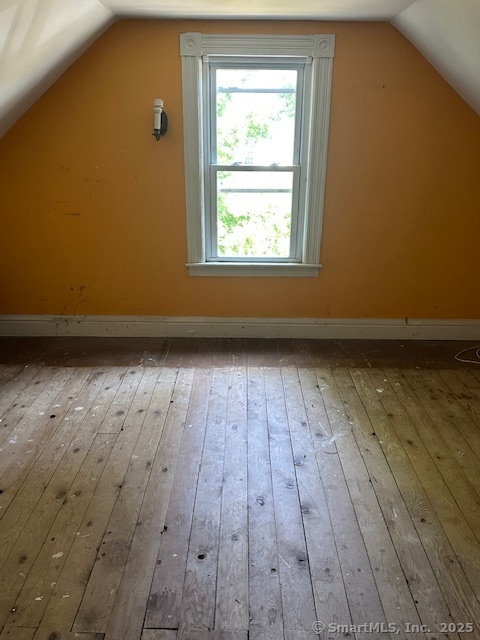 104 Highway 2A Preston, CT 06365 - Photo 10 of 11 an empty room with wooden floor and windows