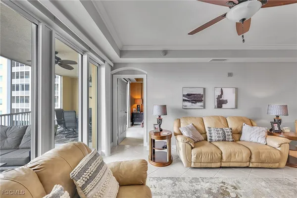 a bed room with a bed and a ceiling fan