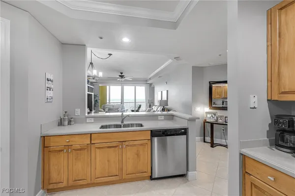 a kitchen with stainless steel appliances granite countertop a sink and cabinets