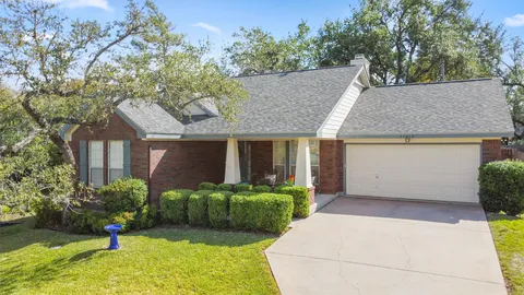a view of a house with a tub and a yard