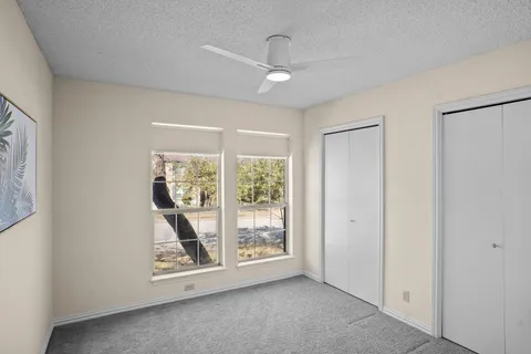 a bathroom with a double vanity sink a mirror and a shower