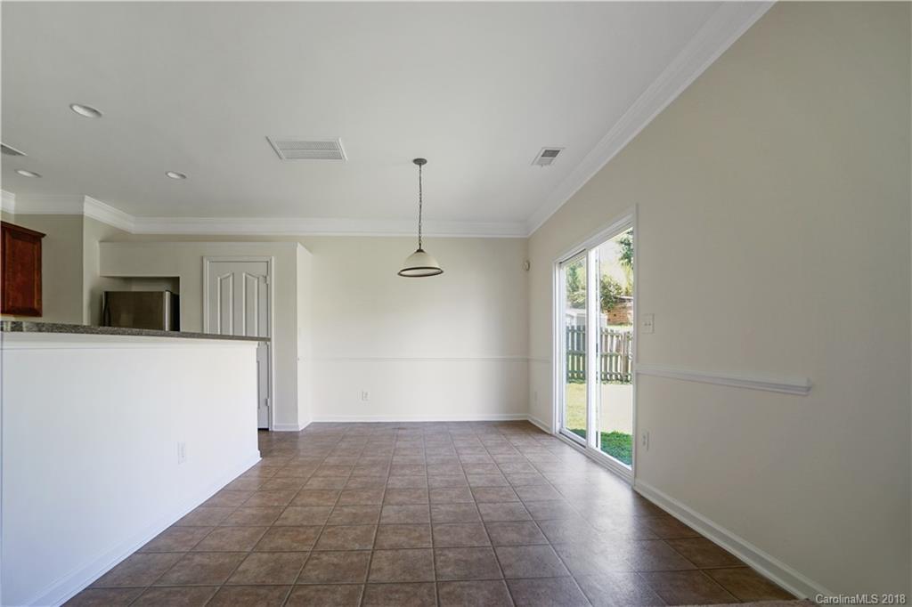 12918 Rothe House Road Charlotte, NC 28273 - Photo 12 of 25 a view of empty room with wooden floor