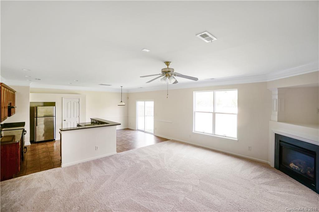 12918 Rothe House Road Charlotte, NC 28273 - Photo 17 of 25 a large kitchen with cabinets and stainless steel appliances