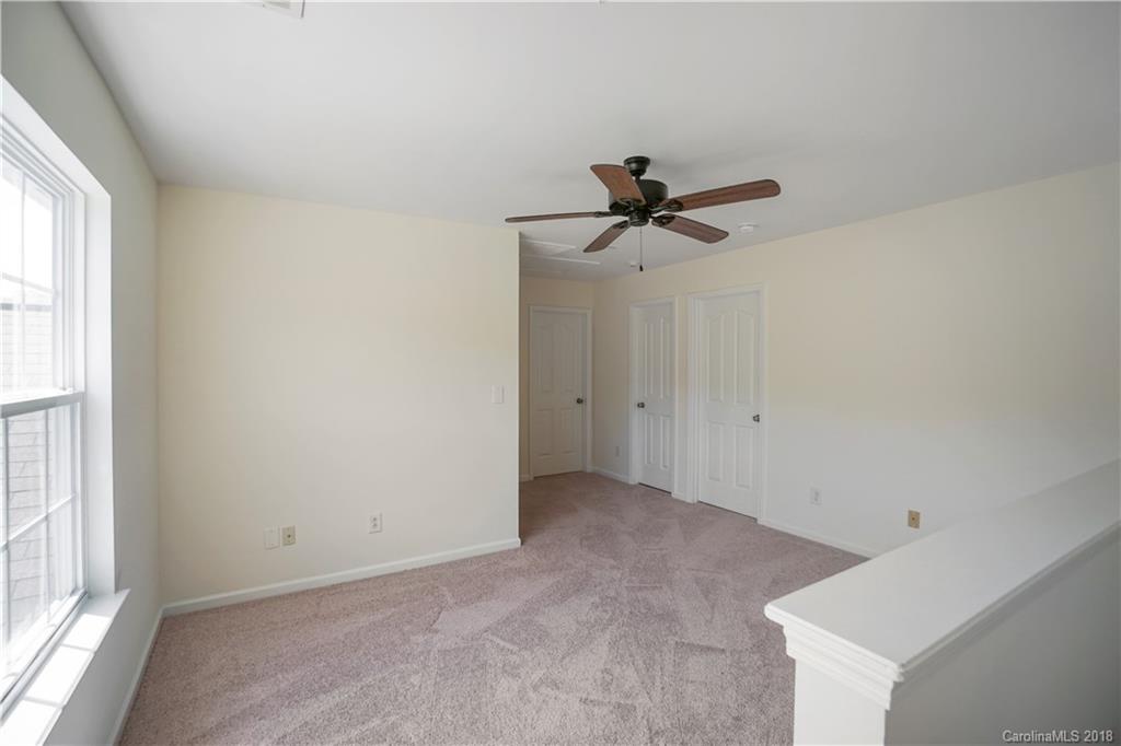 12918 Rothe House Road Charlotte, NC 28273 - Photo 18 of 25 a view of room with ceiling fan and window