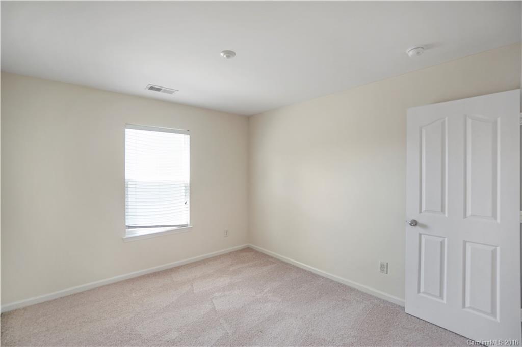 12918 Rothe House Road Charlotte, NC 28273 - Photo 19 of 25 an empty room with a window