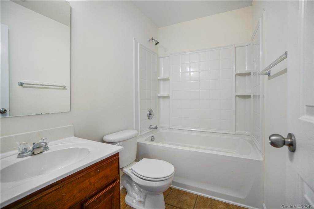 12918 Rothe House Road Charlotte, NC 28273 - Photo 20 of 25 a bathroom with a sink toilet and shower