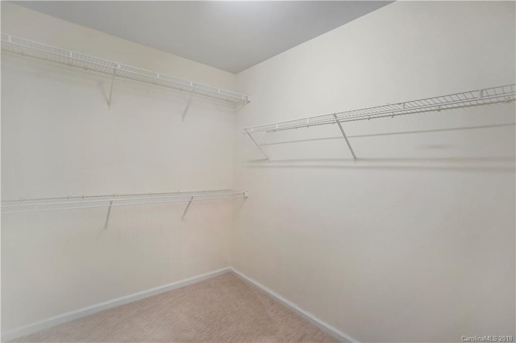 12918 Rothe House Road Charlotte, NC 28273 - Photo 21 of 25 a view of a room with racks on the wall