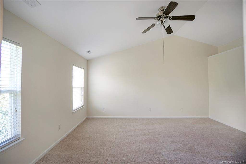 12918 Rothe House Road Charlotte, NC 28273 - Photo 22 of 25 wooden floor in an empty room with a window