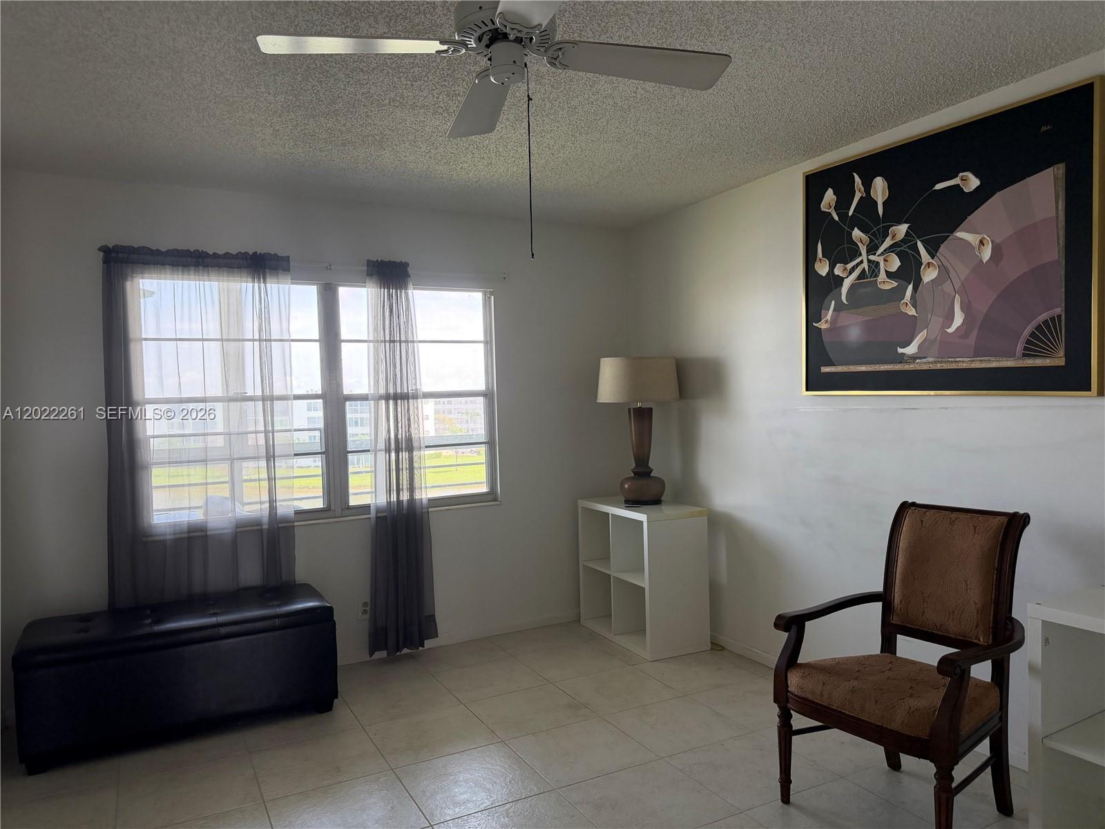 4043 Cornwall C, Unit 4043 Boca Raton, FL 33434 - Photo 3 of 16 a living room with furniture and a window