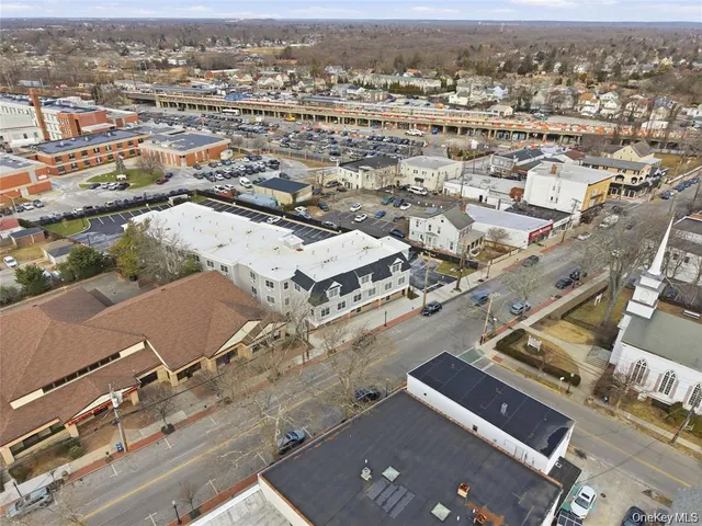 an aerial view of residential building with parking