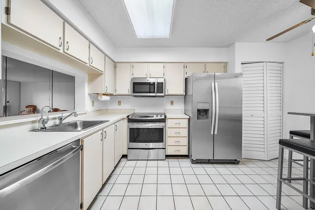 a living room with furniture and a large window with outer view
