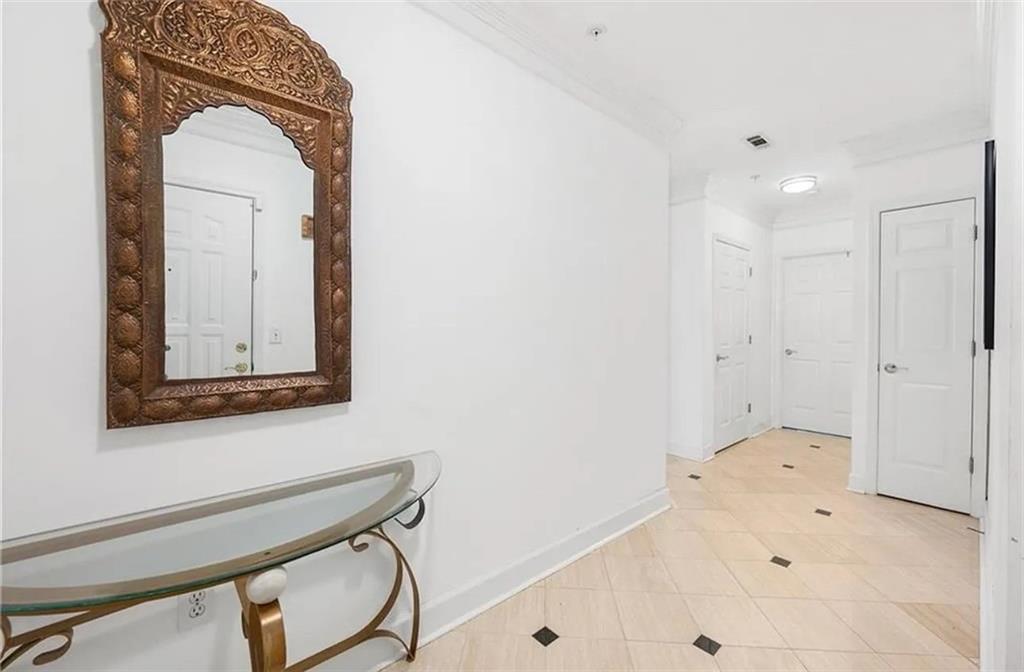 3334 Peachtree Road Northeast, Unit 403 Atlanta, GA 30326 - Photo 11 of 52 a view of a bathroom with a sink and a mirror