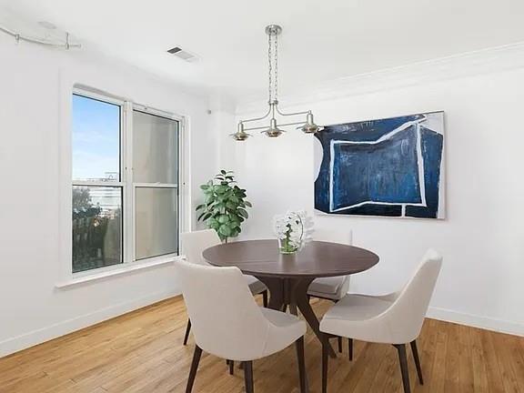 3334 Peachtree Road Northeast, Unit 403 Atlanta, GA 30326 - Photo 3 of 52 a dining room with furniture and window