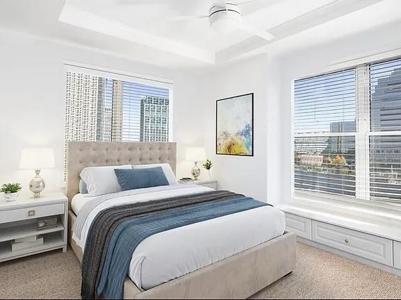 3334 Peachtree Road Northeast, Unit 403 Atlanta, GA 30326 - Photo 4 of 52 a bedroom with a bed and a large window