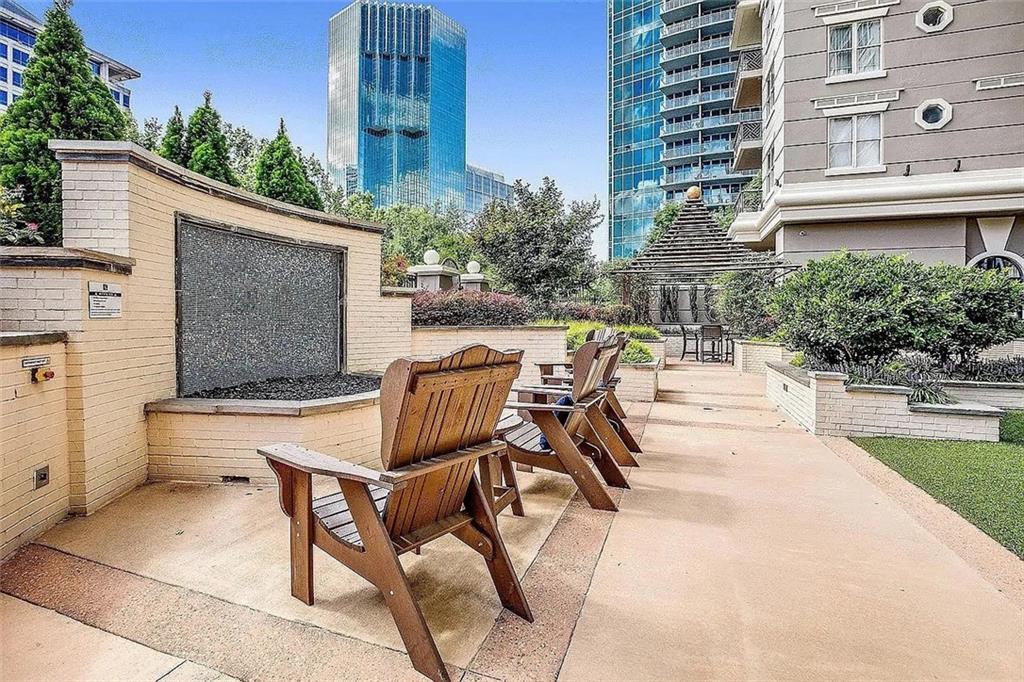 3334 Peachtree Road Northeast, Unit 403 Atlanta, GA 30326 - Photo 46 of 52 a view of a patio with couches table and chairs and potted plants