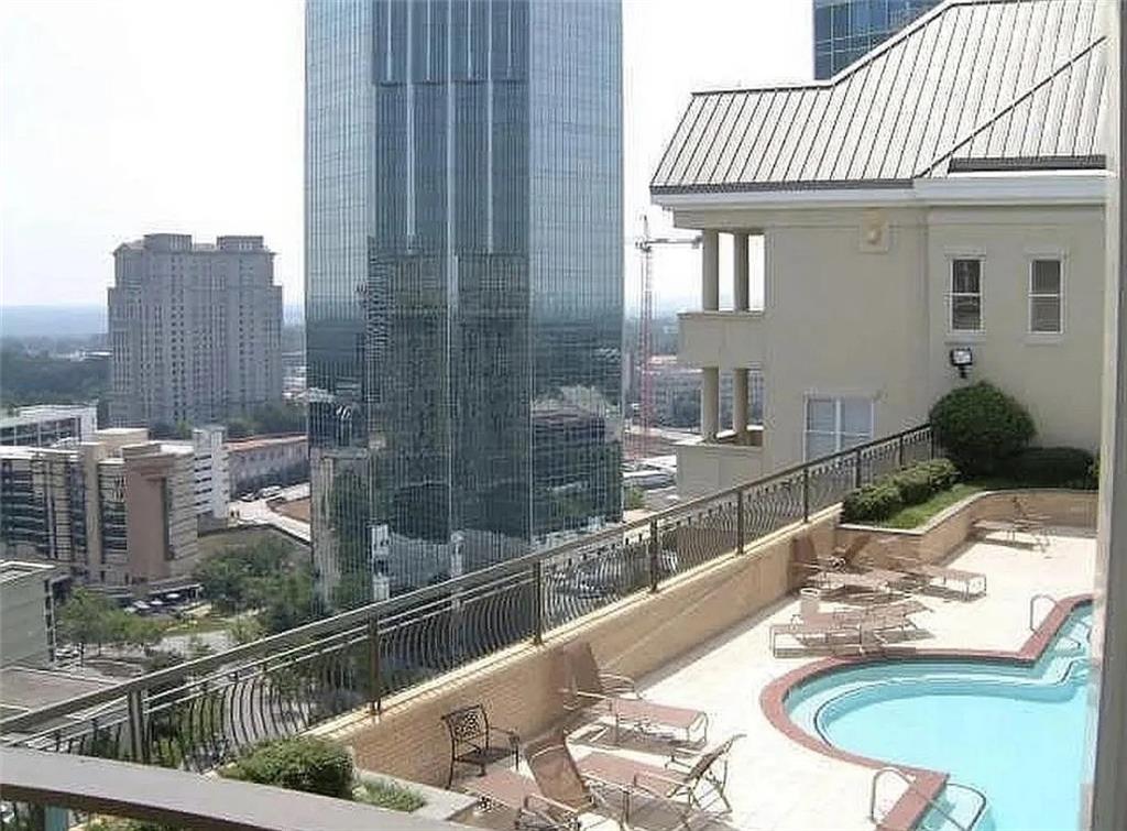 3334 Peachtree Road Northeast, Unit 403 Atlanta, GA 30326 - Photo 48 of 52 a bathroom with a granite countertop sink and a mirror