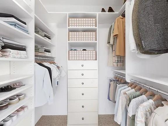 3334 Peachtree Road Northeast, Unit 403 Atlanta, GA 30326 - Photo 6 of 52 a view of walk in closet with clothes and shoes