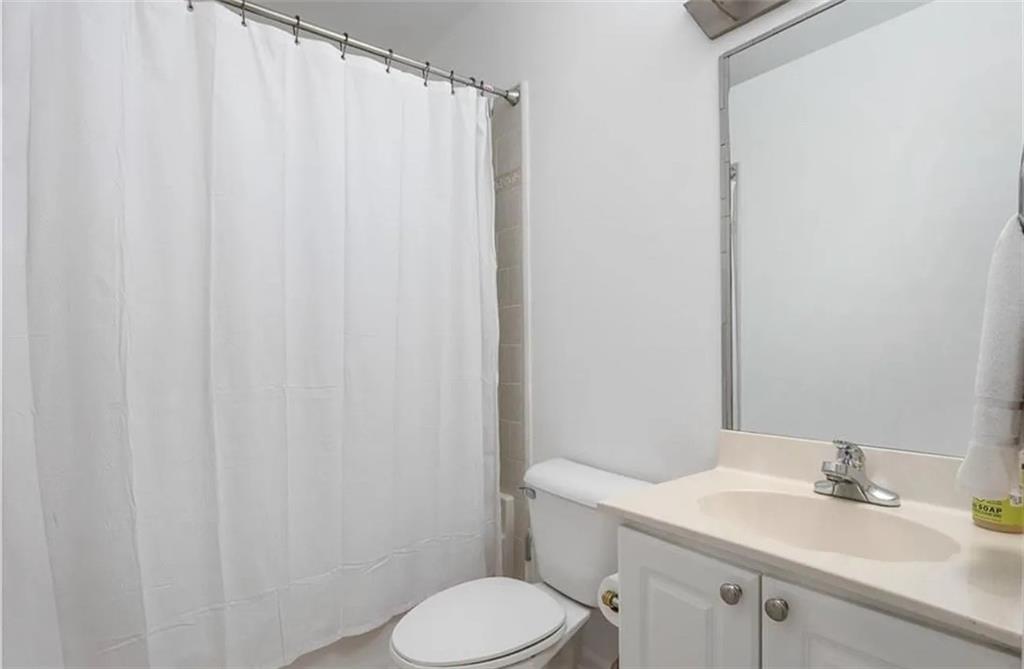 3334 Peachtree Road Northeast, Unit 403 Atlanta, GA 30326 - Photo 9 of 52 a bathroom with a sink and toilet
